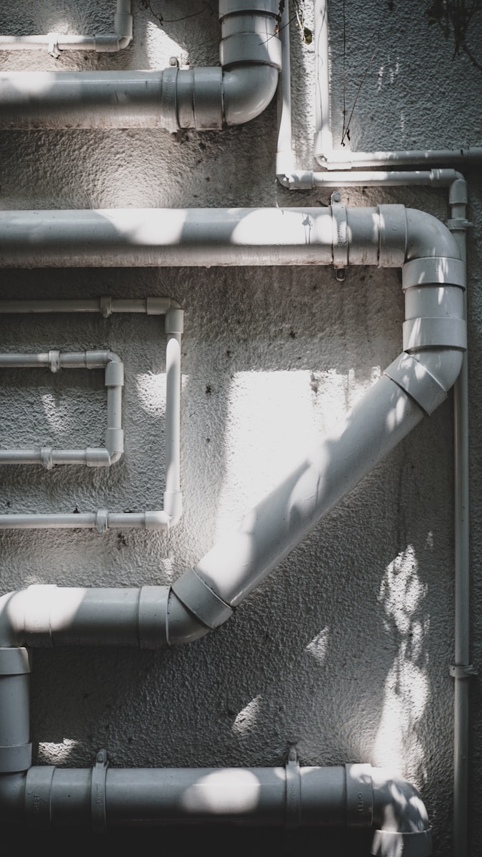 white pipe representing regular plumbing inspection